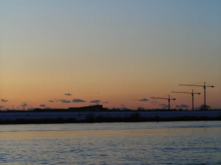 Sunset and three cranes